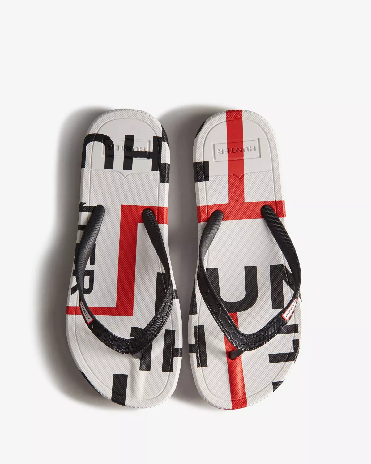 サンダル・ミュール HUNTER WOMEN Exploded Logo Flip Flops Black WFD1058EXLBLK Women's Exploded Logo Flip Flops by Hunter at THE MILE